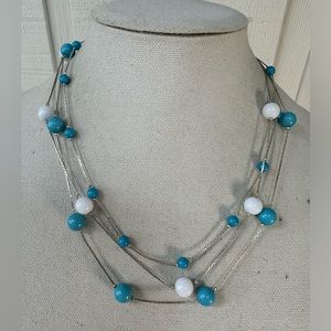 Blue and white bead station style necklace